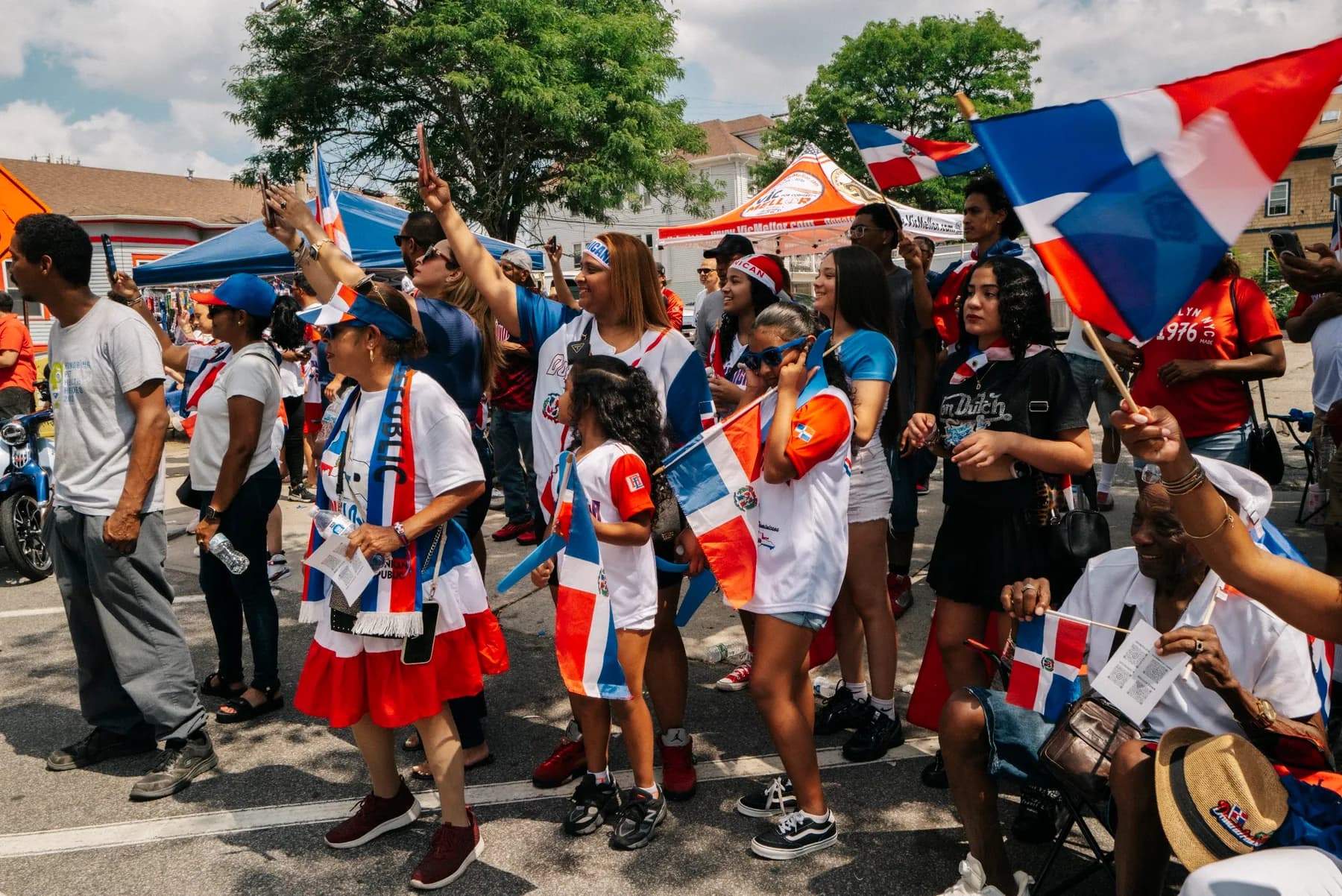 Community members in Dominican colors gather together at the 2026 Providence parade